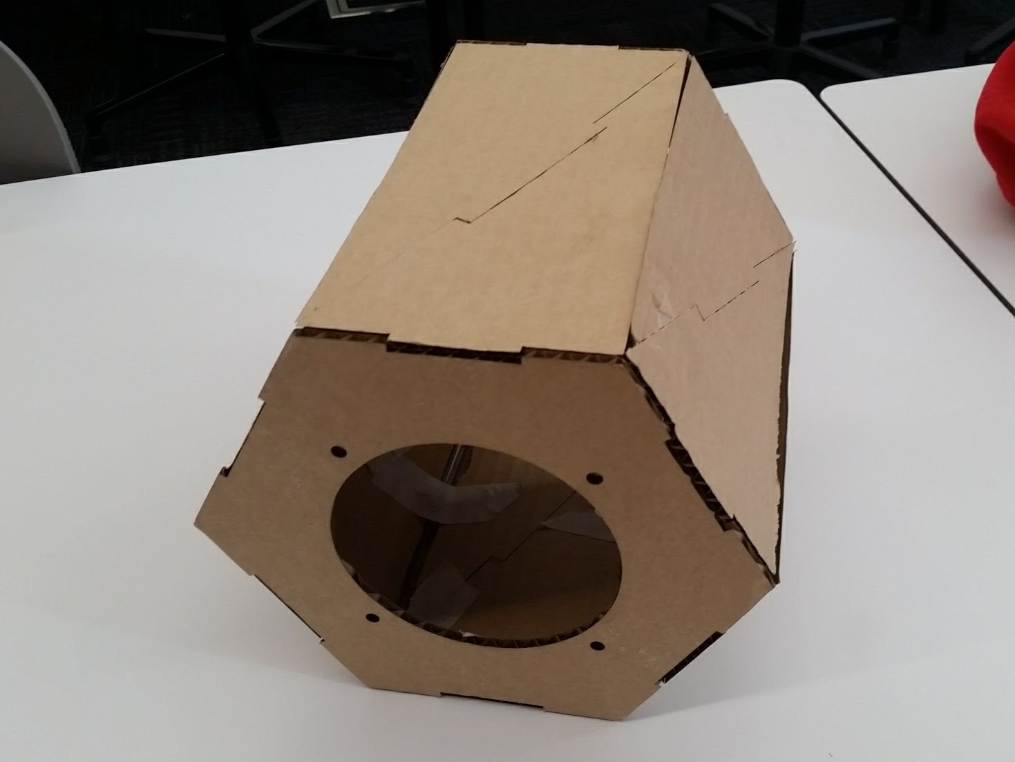 The speaker box was designed in PTC Creo Sketch. Shown is a prototype laser cut from cardboard