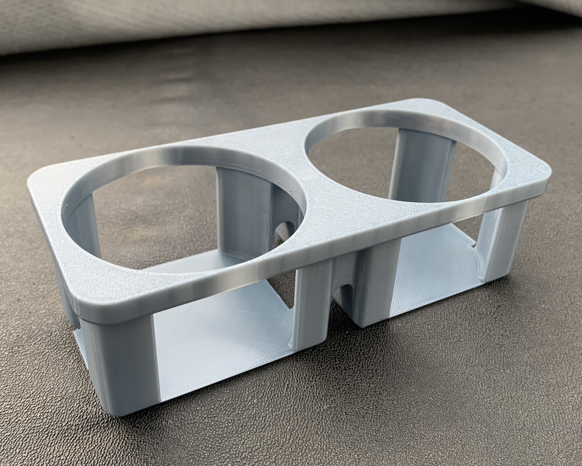 A rectangular hole in the centre console was a perfect place for a cupholder, but the early Ford Capri models never had one. I 3D printed an insert from ASA plastic. The cupholder can fit two 355ml aluminium cans perfectly.