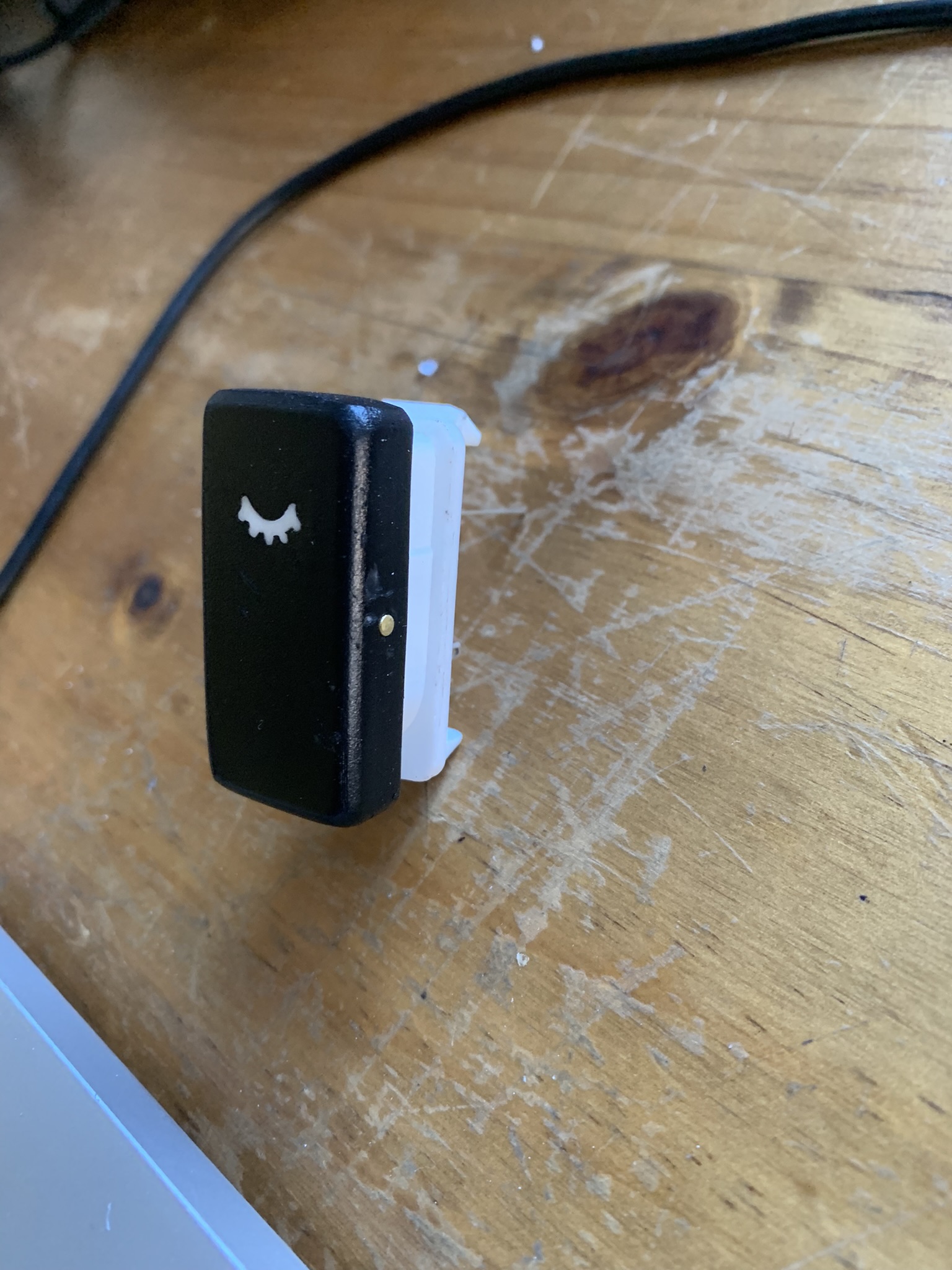 I designed and 3D printed a backlit switch to match the existing switches in the car.