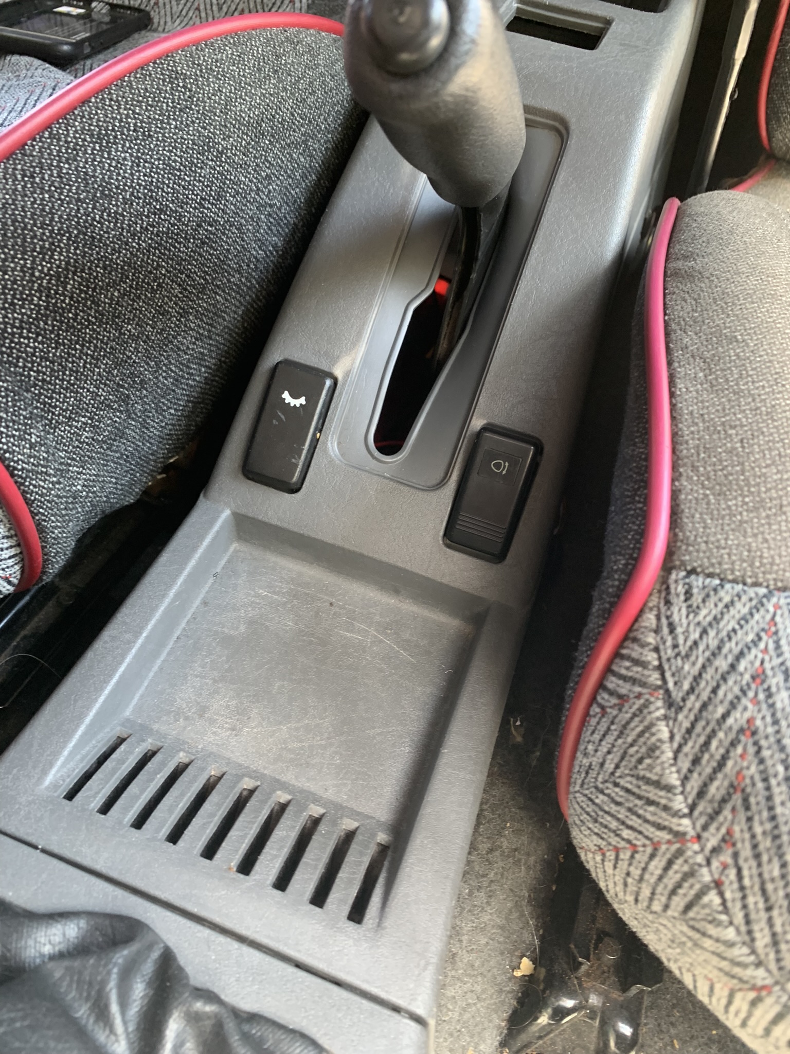 The switch fit into an existing blanked hole, and was wired into the cars backlight circuit. This system serves as a working prototype and has functioned as intended for over two years.