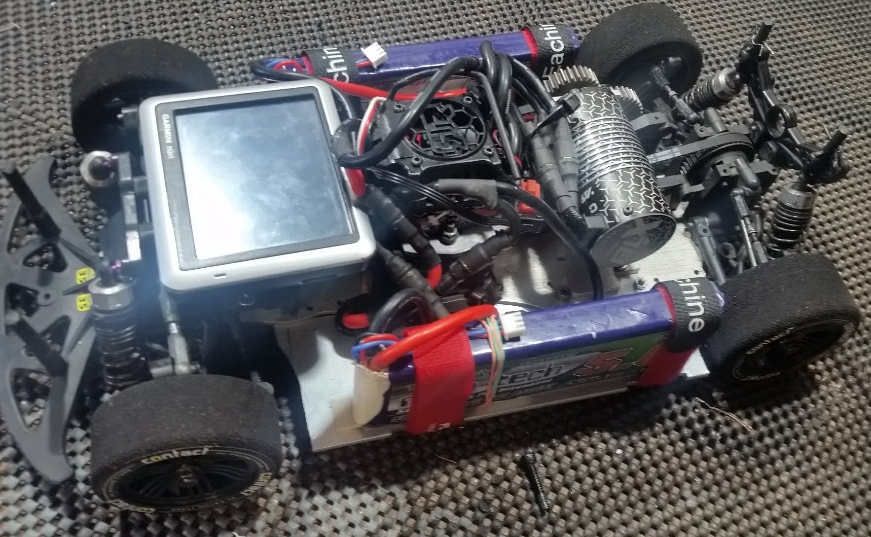 With a massive 6s brushless system installed, batteries strapped, and a GPS fitted, this car was ready to meet the curb on its maiden run. It was a light crash and I only bent the motor mount.