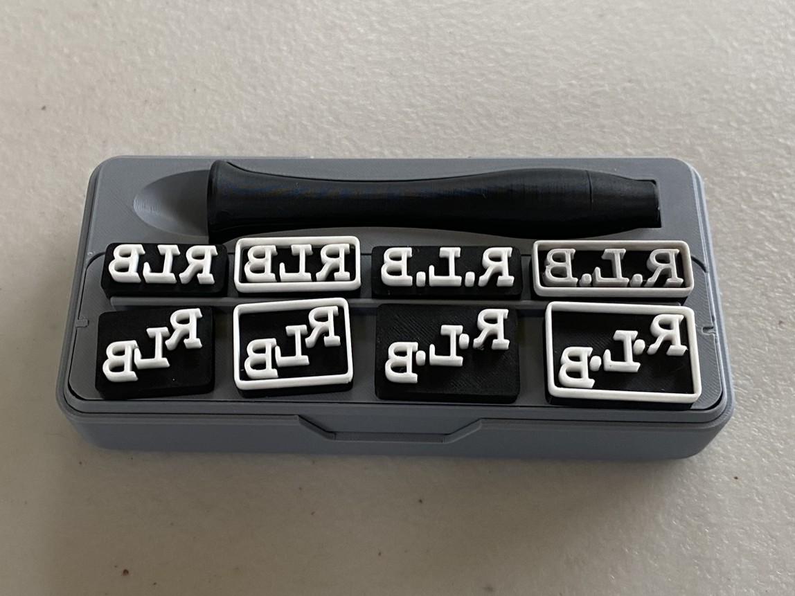 Stamp with interchangeable heads