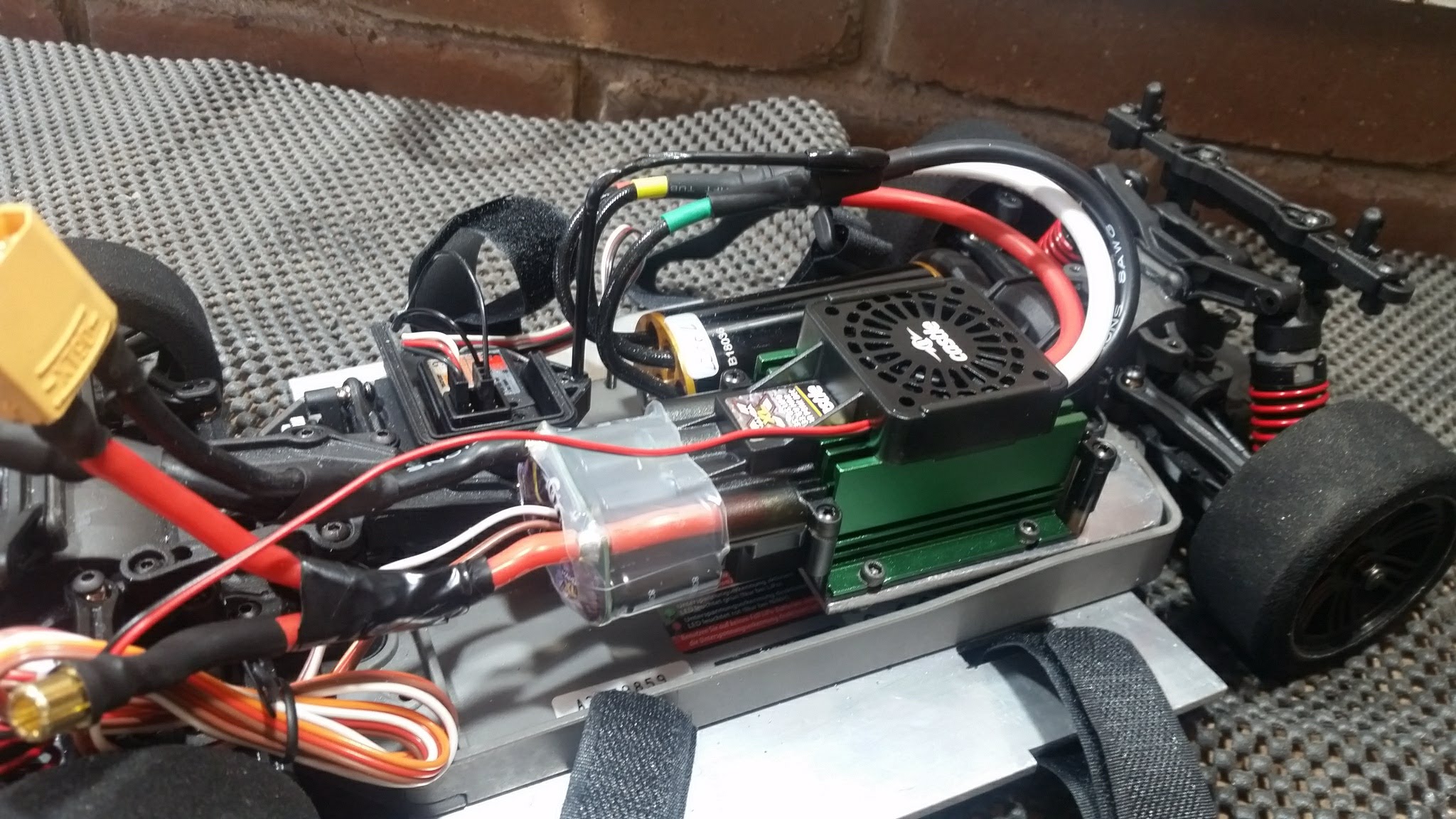 The plan was to cram a massive 8S power system into the tiny 1/10 scale car. With some custom aluminum mounts and battery trays, I was able to fit the Castle XLX ESC and TP Power 2200kv motor into this chassis.