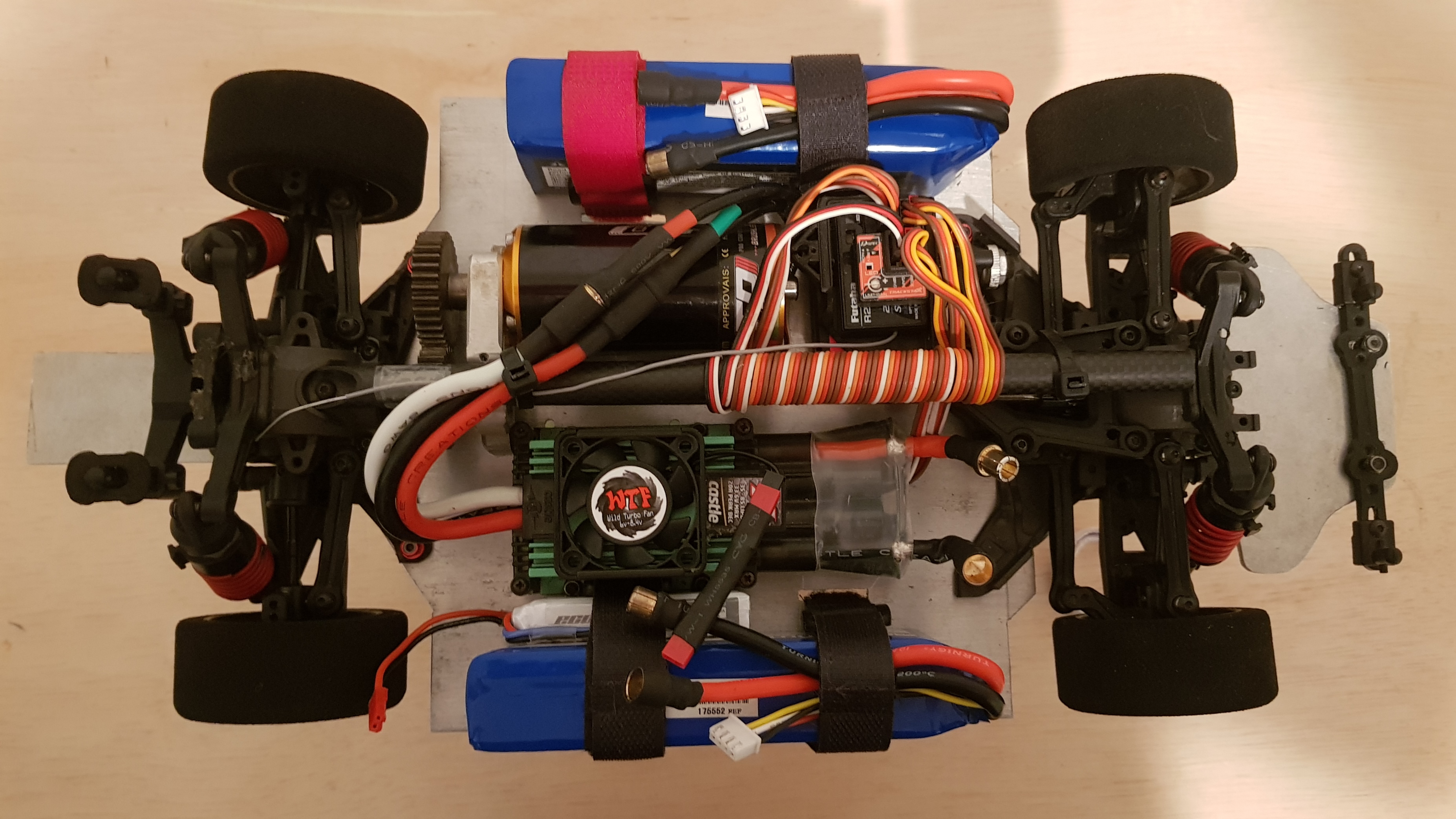 A carbon fibre centre brace was added to stiffen the chassis, along with an electronic gyro to stabilize the steering, and a smaller battery to power the auxiliary electronics. Unfortunately due to costs, lack of testing opportunities, and interest in other projects, this RC car was shelved.